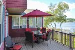The ocean-facing deck with comfortable patio furniture and grill